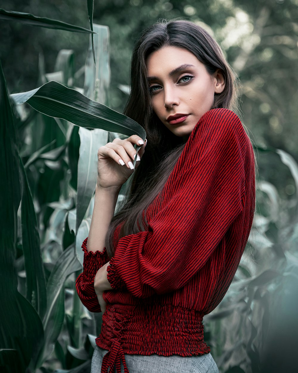 woman in red sweater smiling