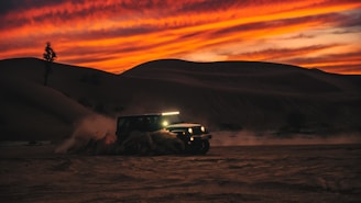 Thrilling dune bashing action with a 4x4 kicking up sand against a deep blue sky