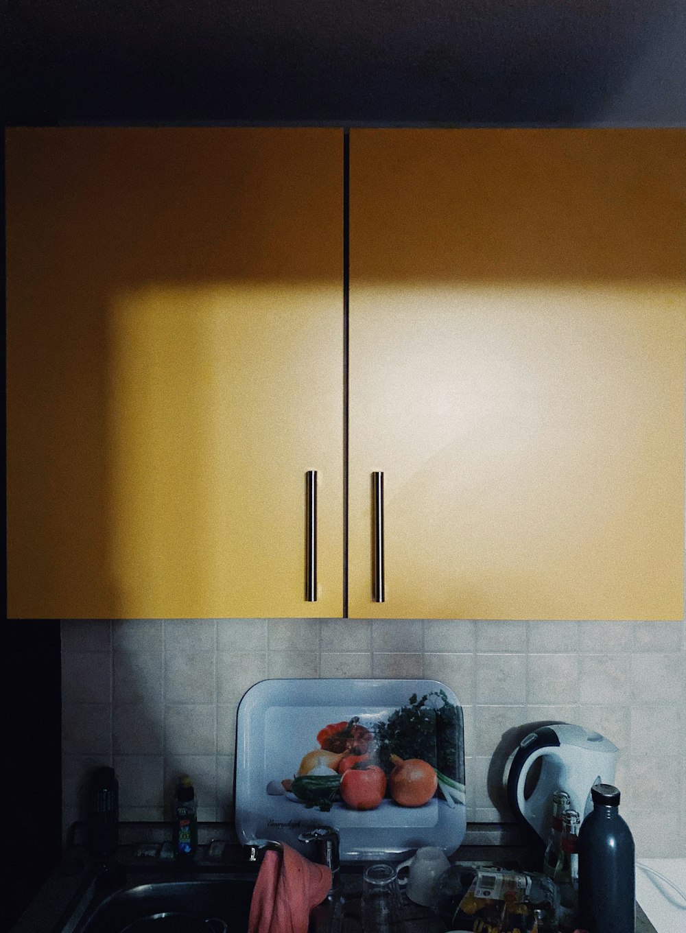 white wooden cabinet beside white ceramic sink