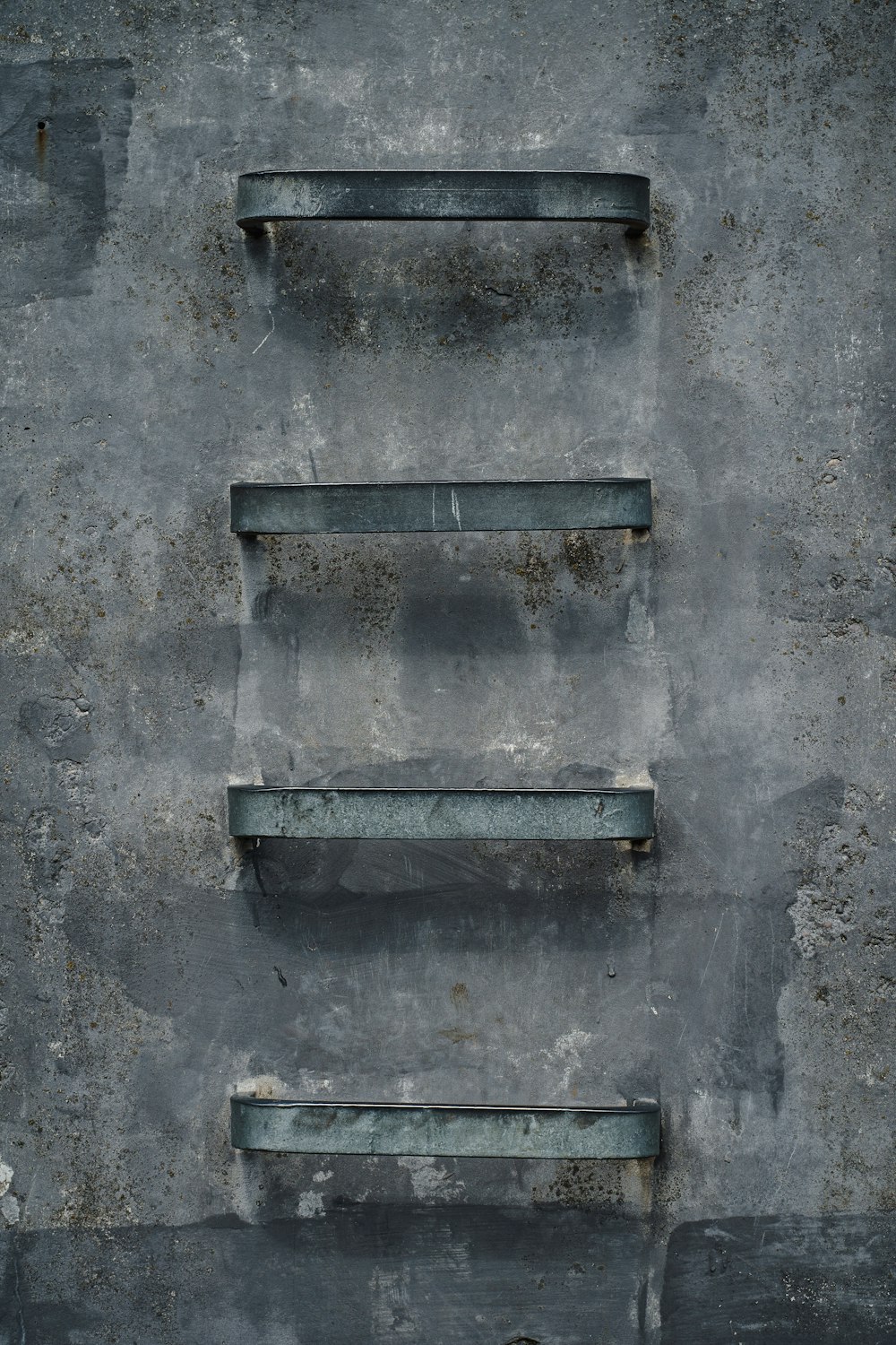 blue metal frame on gray concrete wall