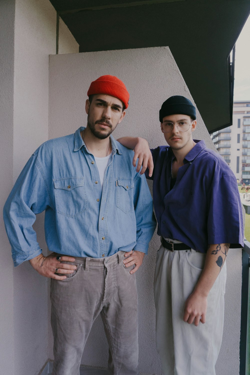 man in blue dress shirt and red knit cap