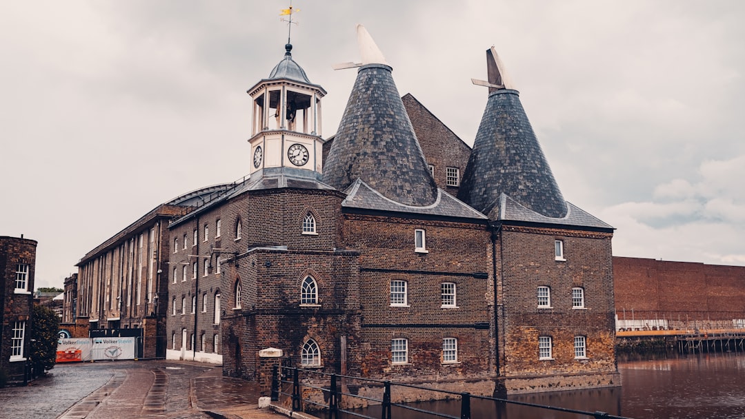 brown brick building under cloudy sky during daytime