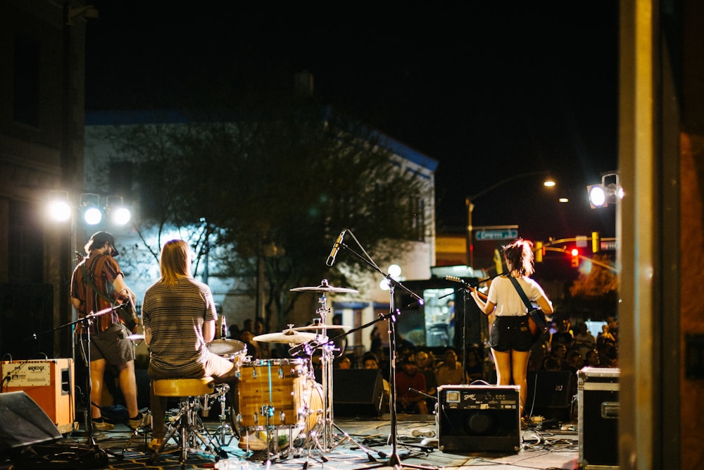 people playing musical instruments during night time