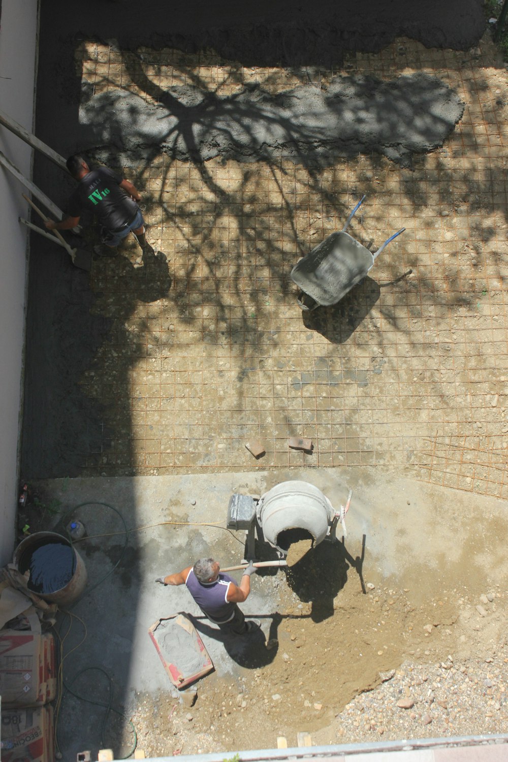 white plastic bucket on brown brick floor