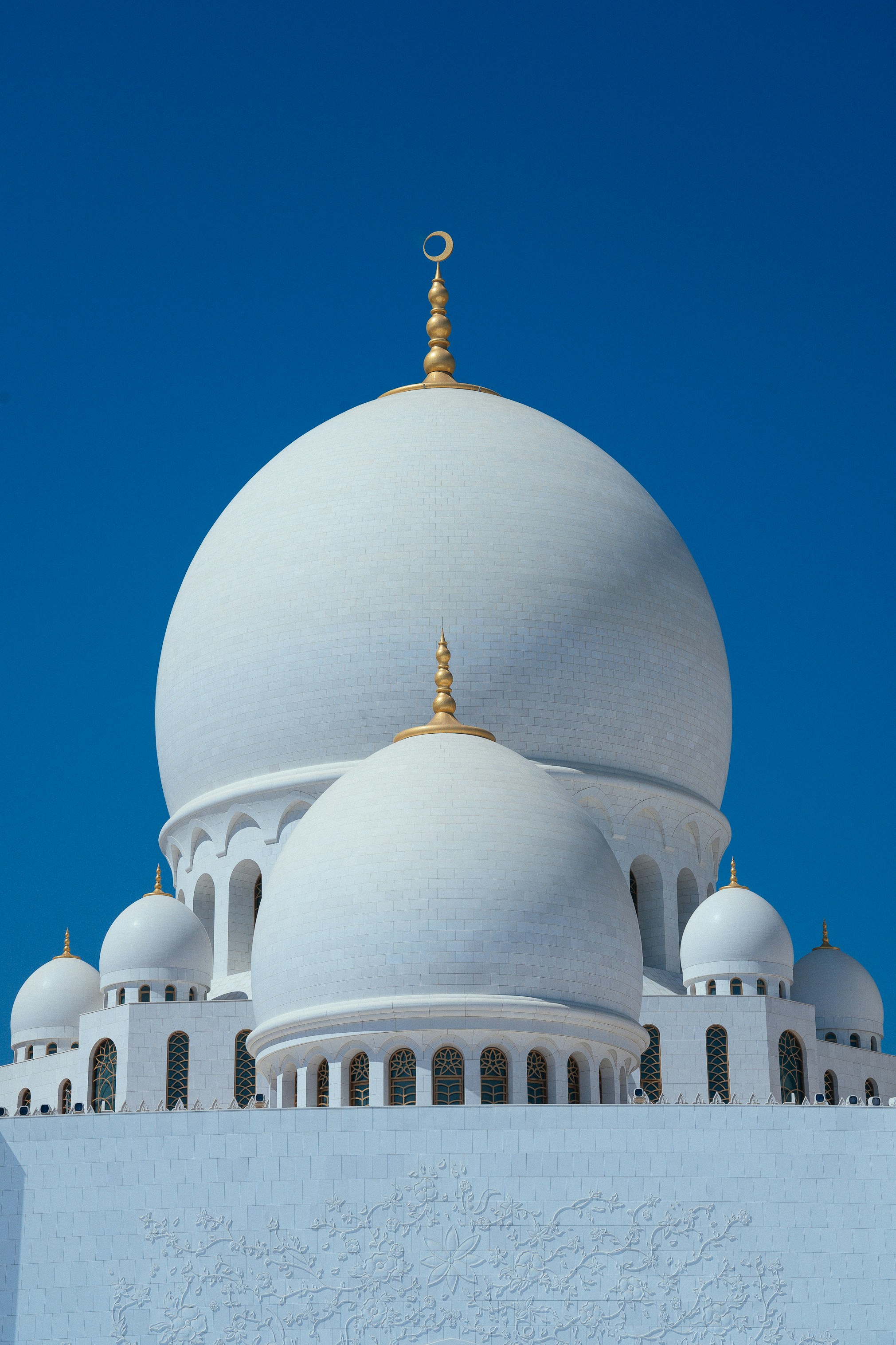 white concrete dome building under blue sky during daytime