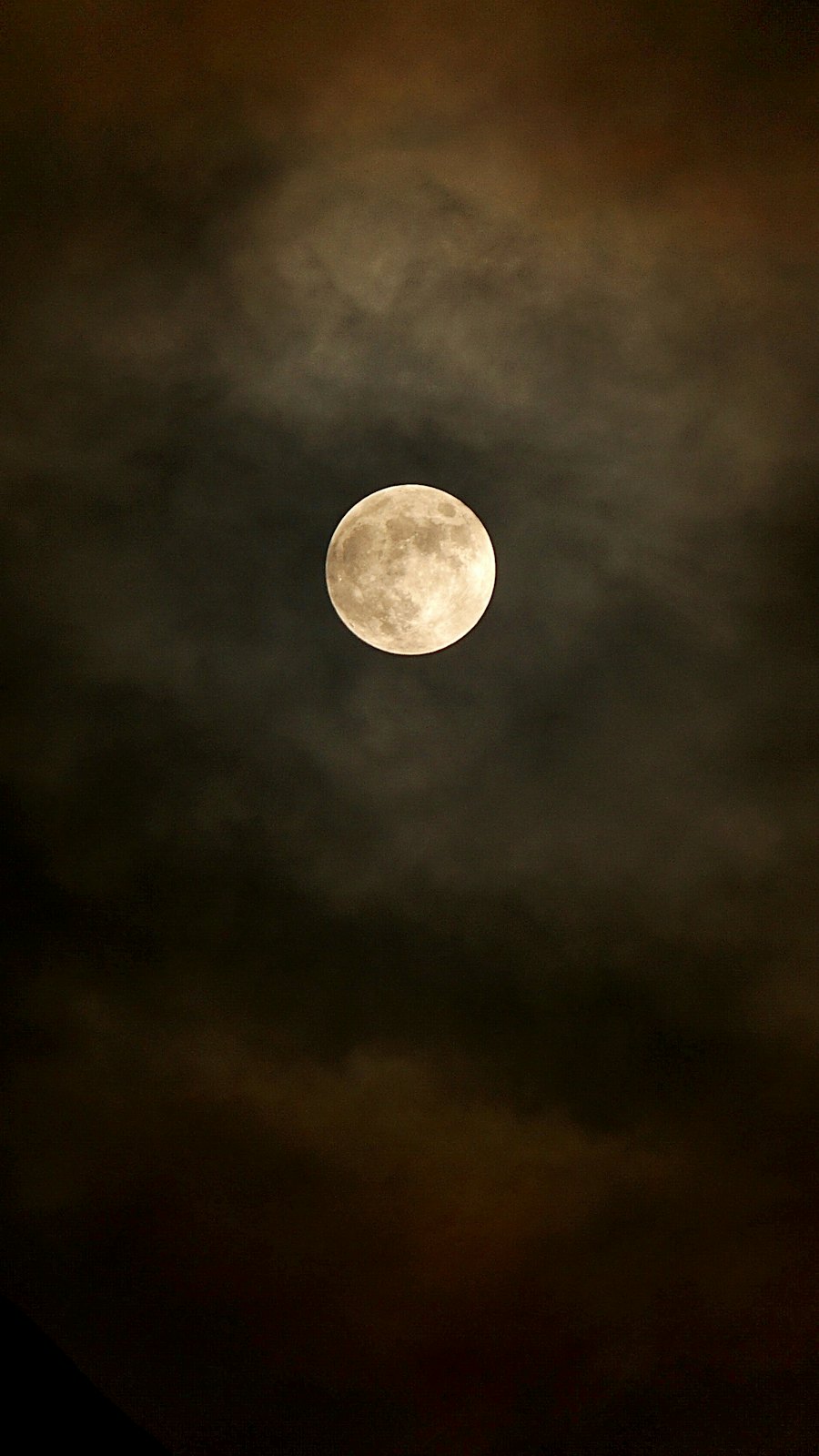 Full moon glowing over a dark night sky