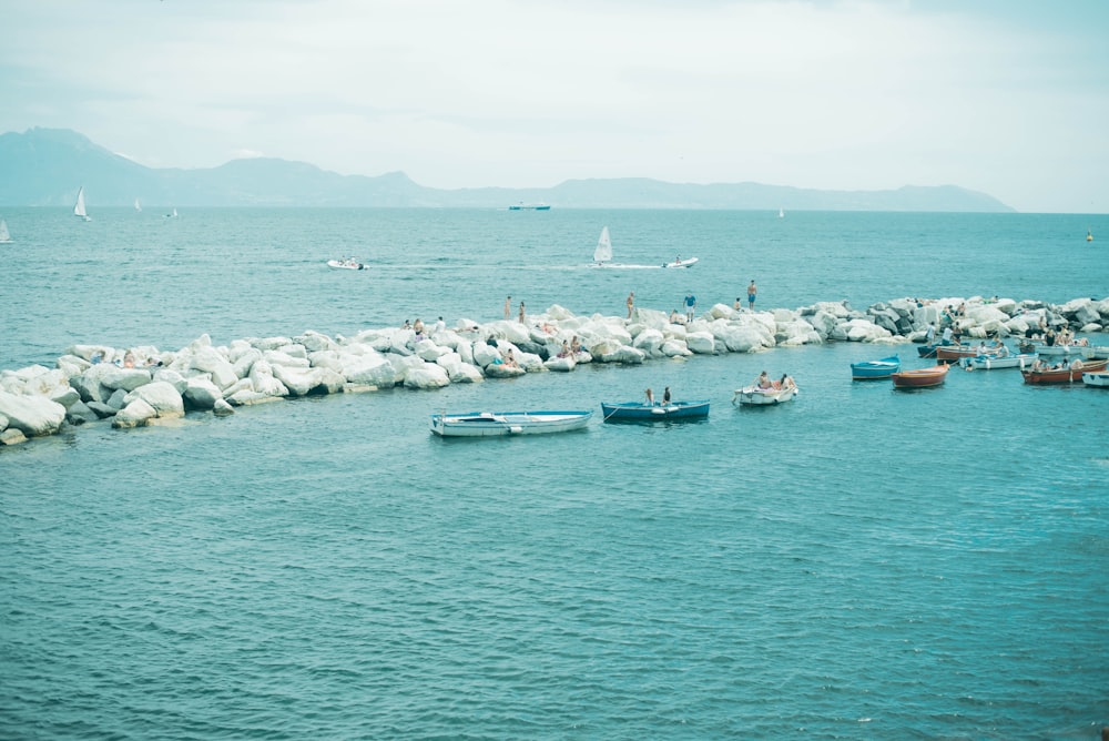 people riding on boat on sea during daytime