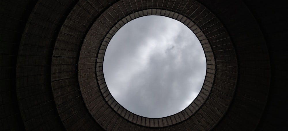 brown brick wall under white clouds during daytime