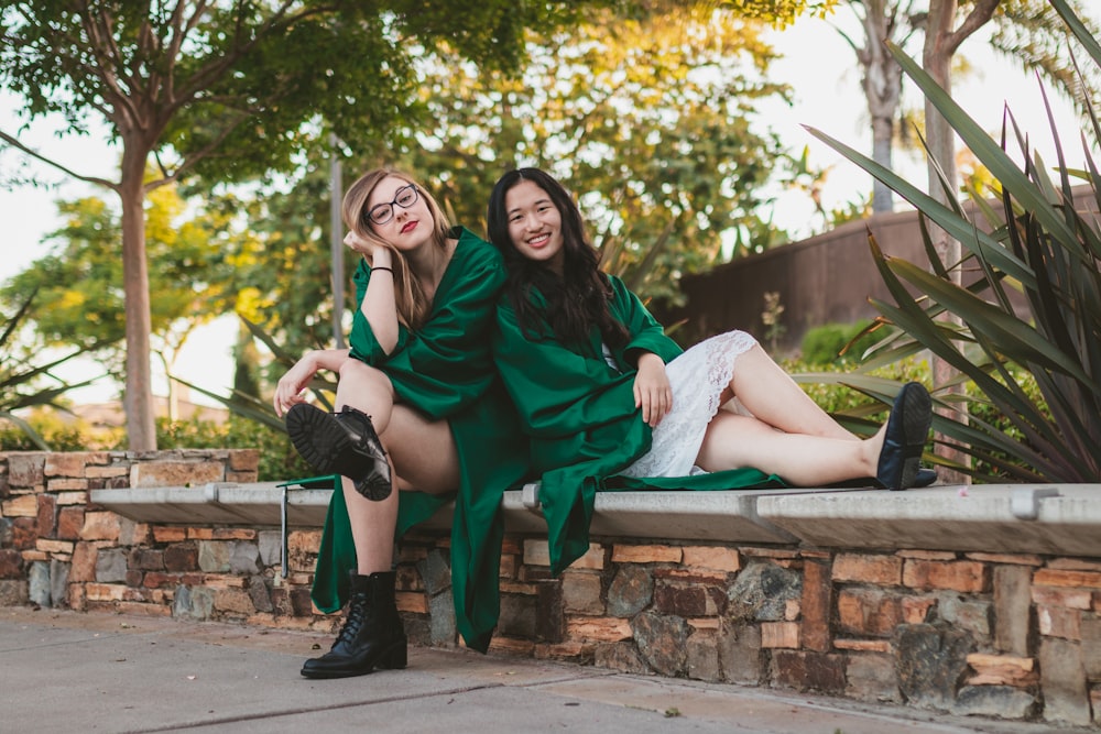 2 women sitting on bench