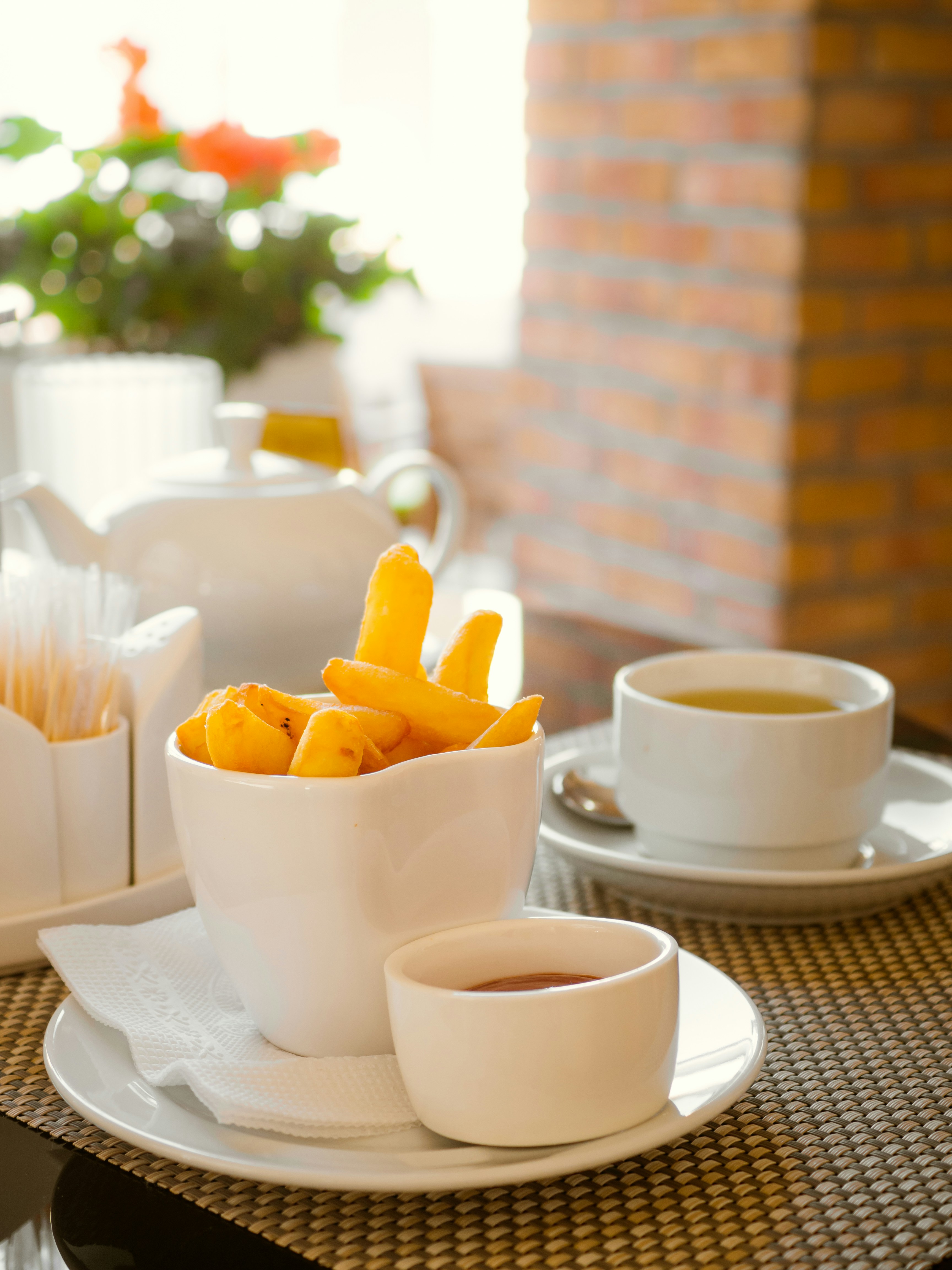 white ceramic teacup on white ceramic saucer