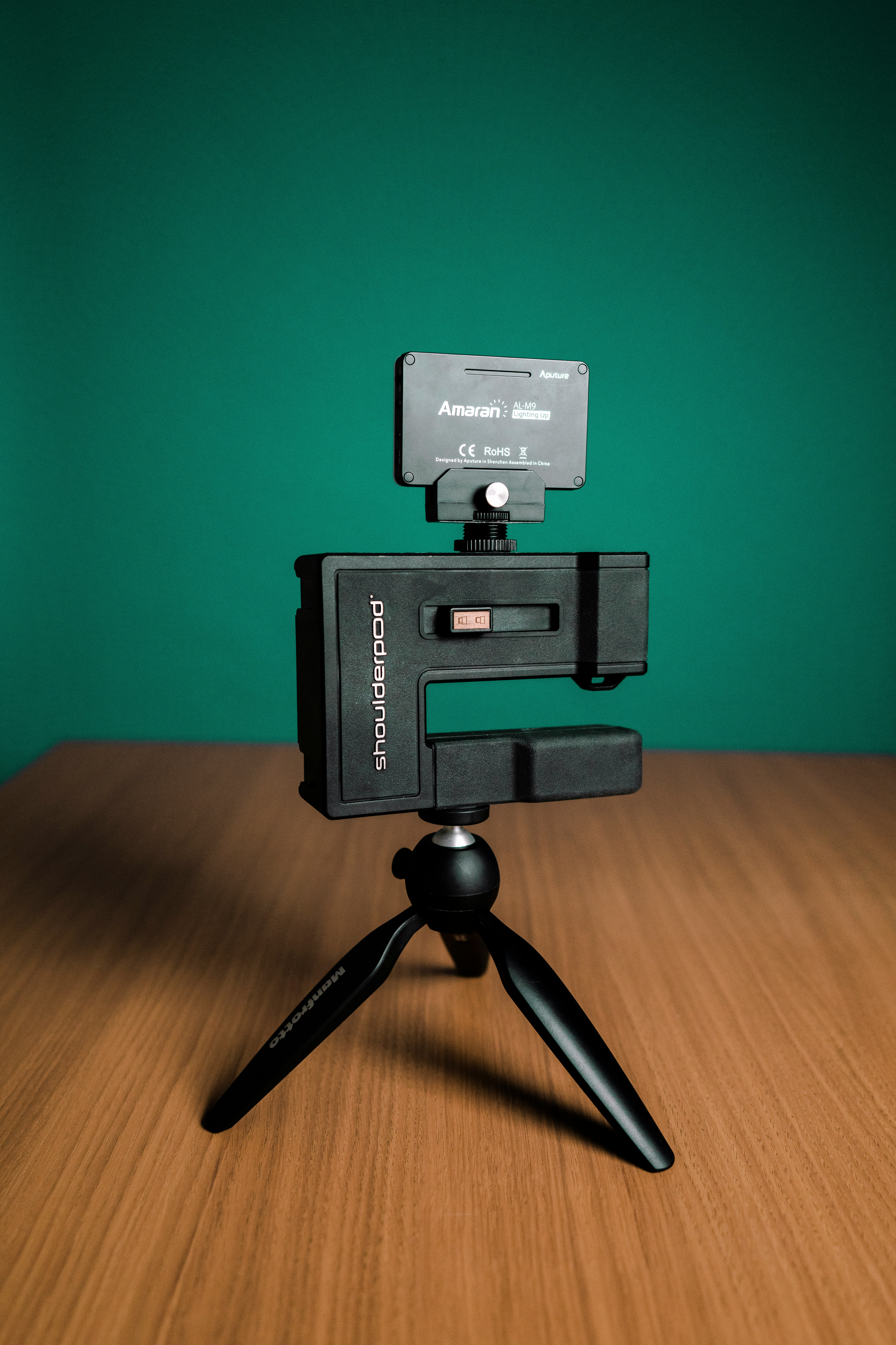 black and gray camera on brown wooden table