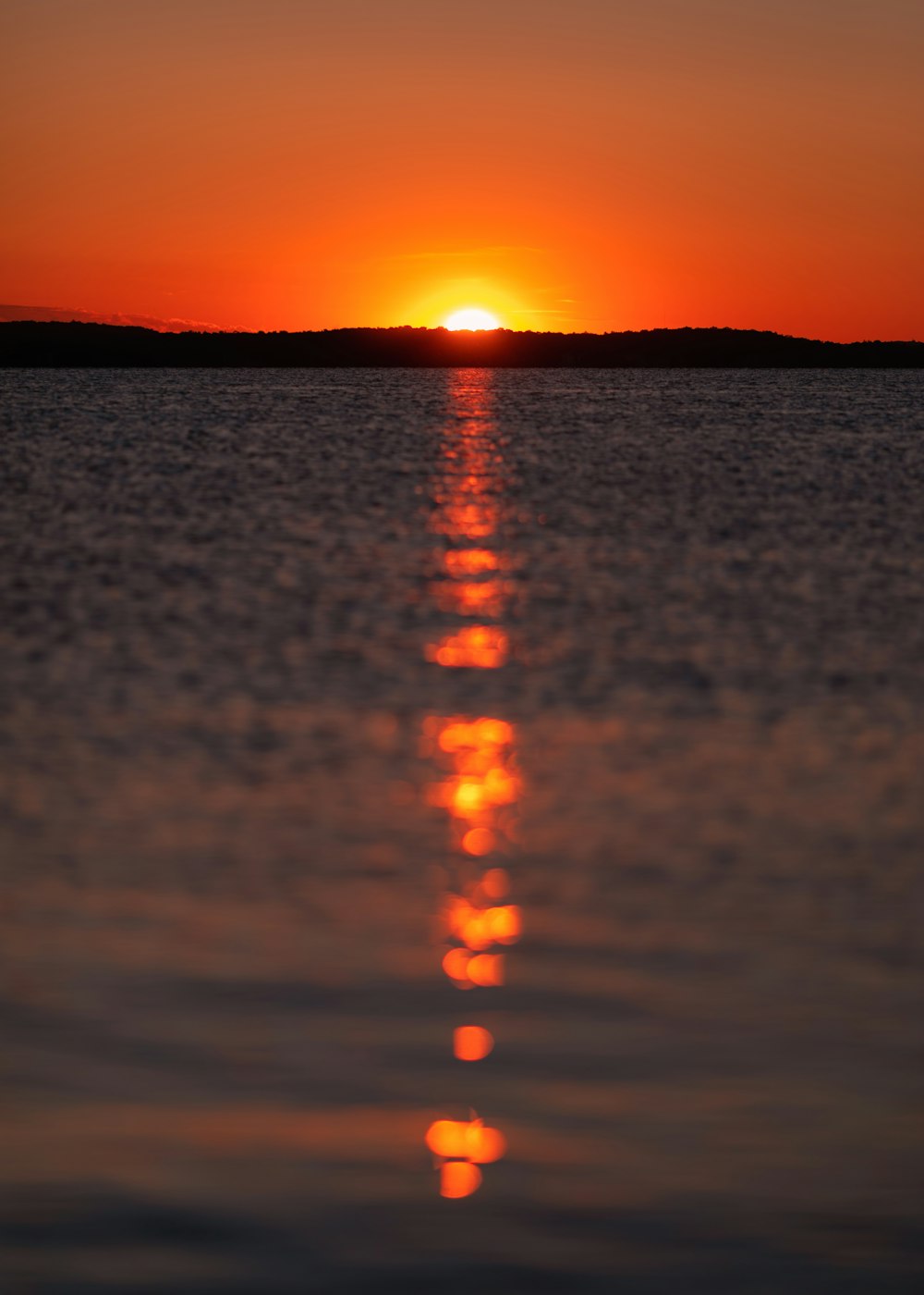 body of water during sunset