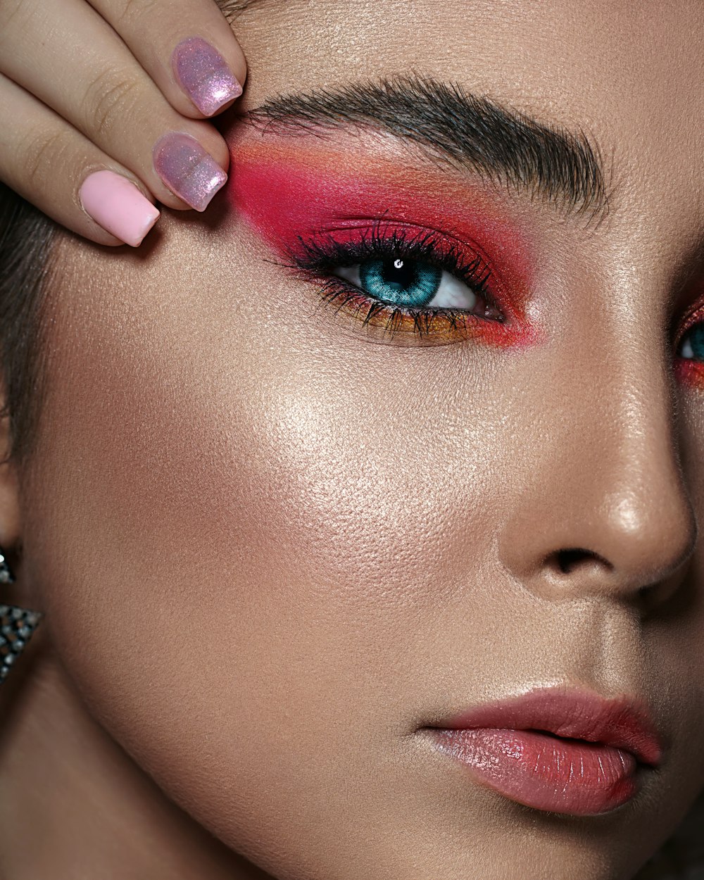 woman with pink lipstick and silver ring