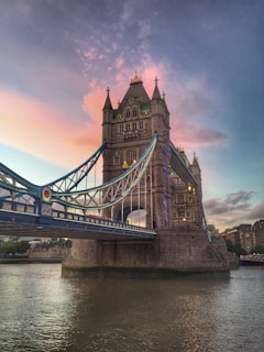 brown concrete bridge under blue sky