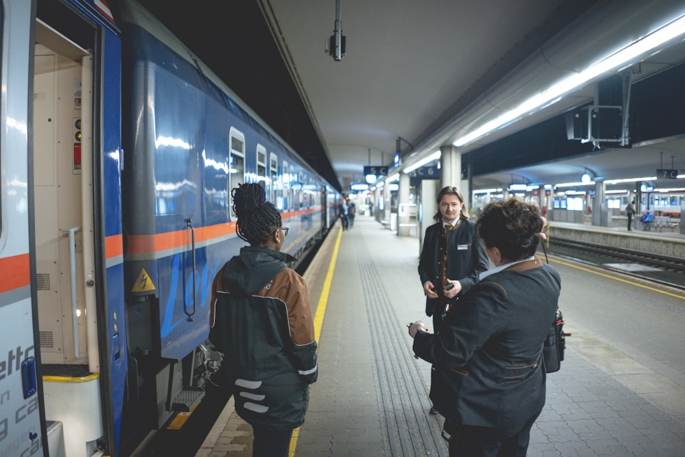 people in train station during daytime