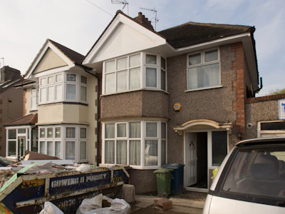 cars parked in front of brown concrete building during daytime