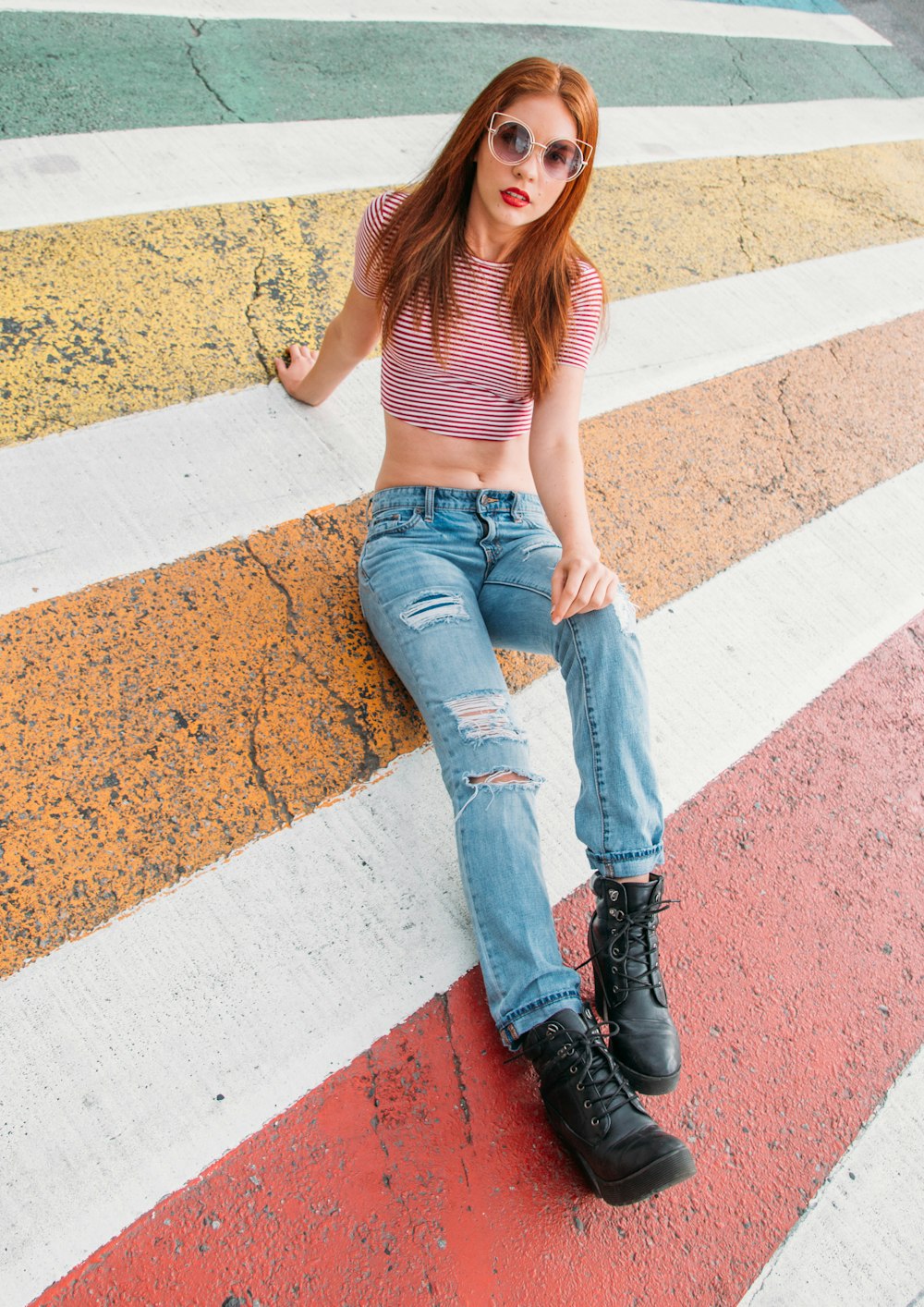 woman in blue denim jeans and brown tank top