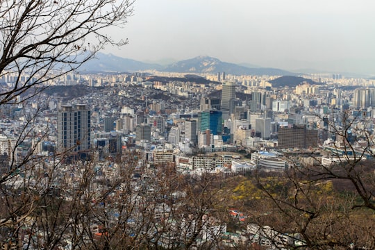 city with high rise buildings during daytime in Namsan Tower South Korea