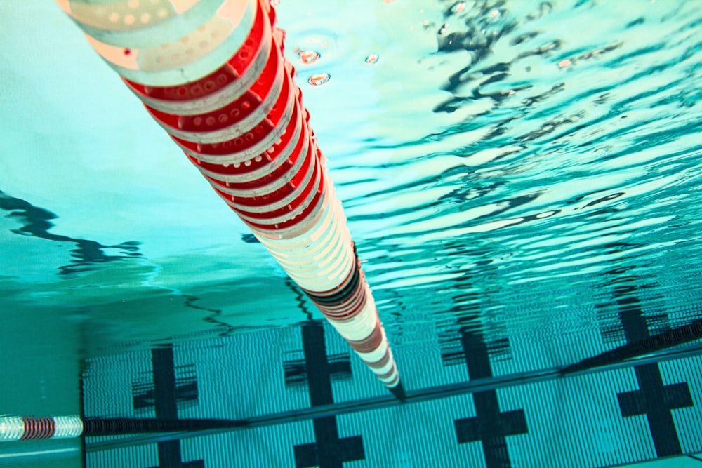 red and white striped water bottle