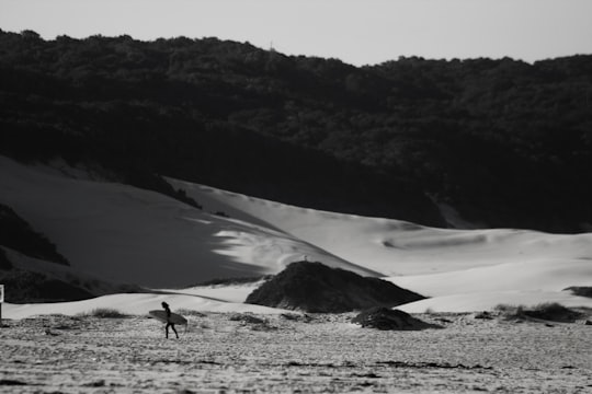 person walking on snow covered field during daytime in Port Alfred South Africa