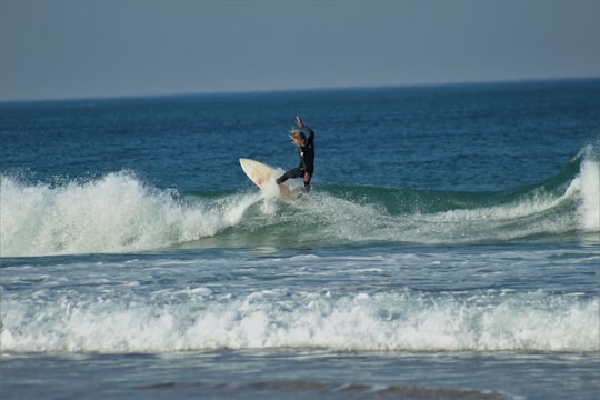 man surfing on sea waves during daytime in Port Alfred South Africa