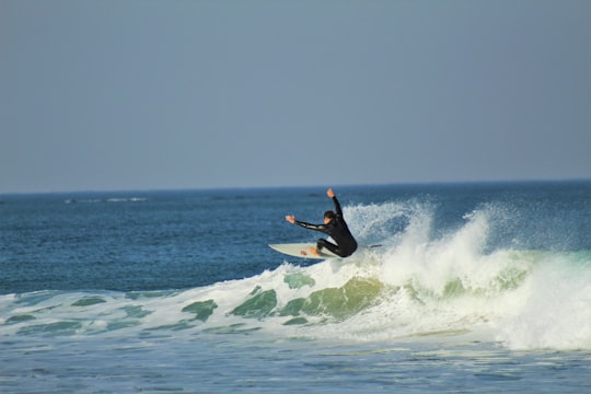 man surfing on sea waves during daytime in Port Alfred South Africa