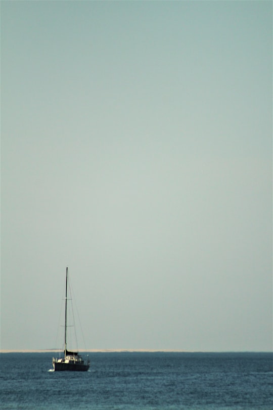 sailboat on sea under gray sky in Port Alfred South Africa