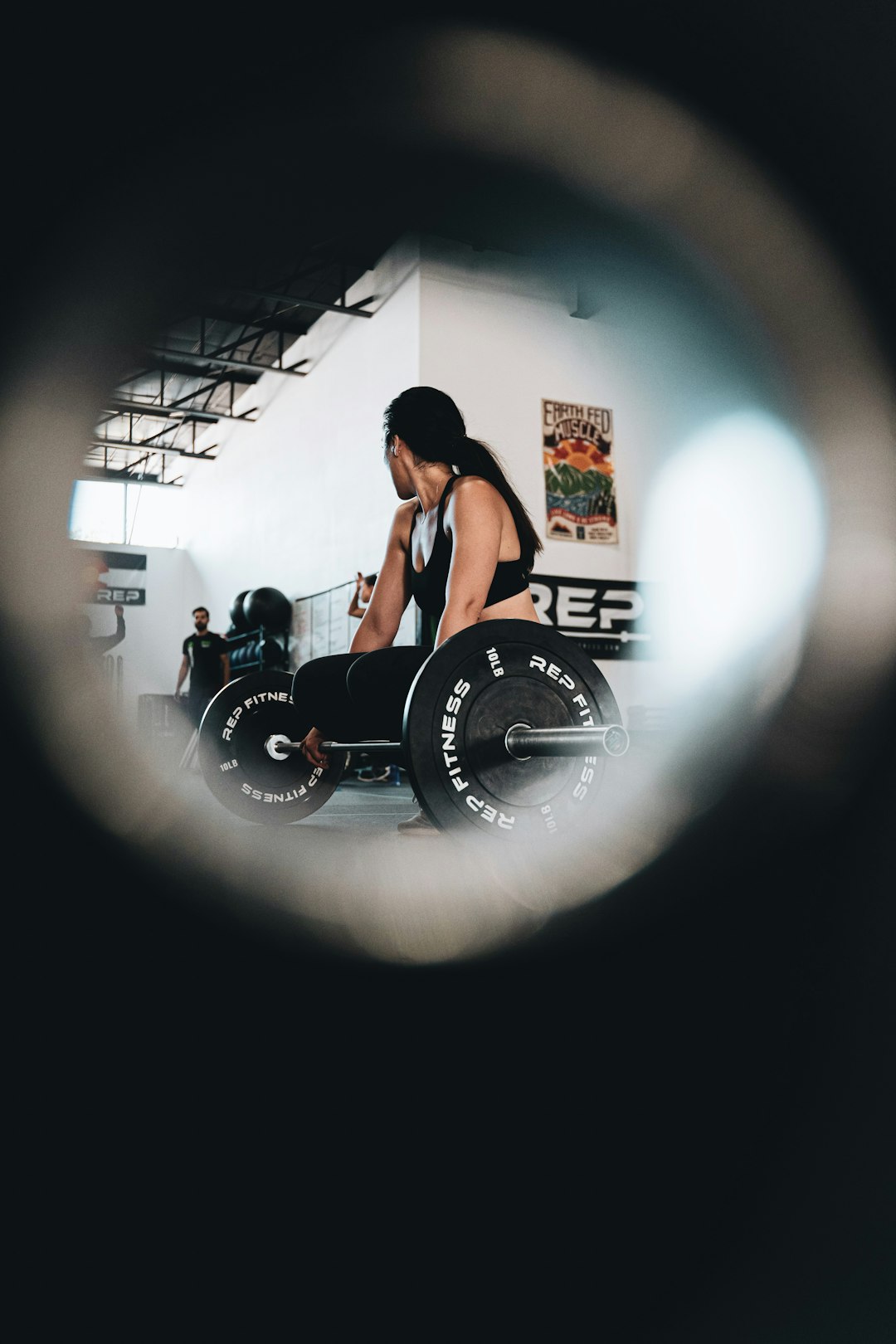 woman in black tank top and black shorts sitting on black wheel chair