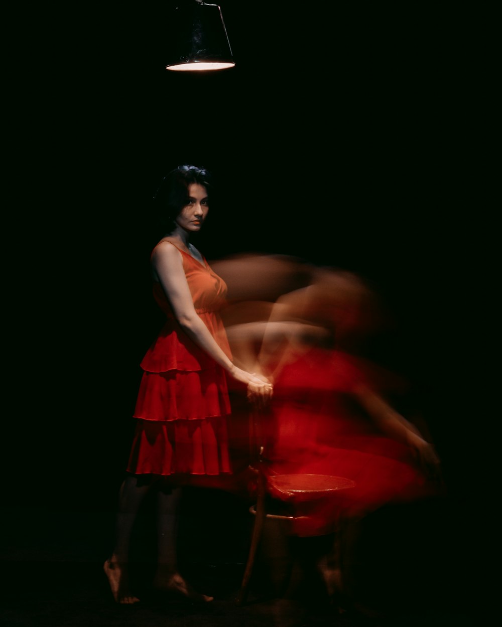 woman in red sleeveless dress