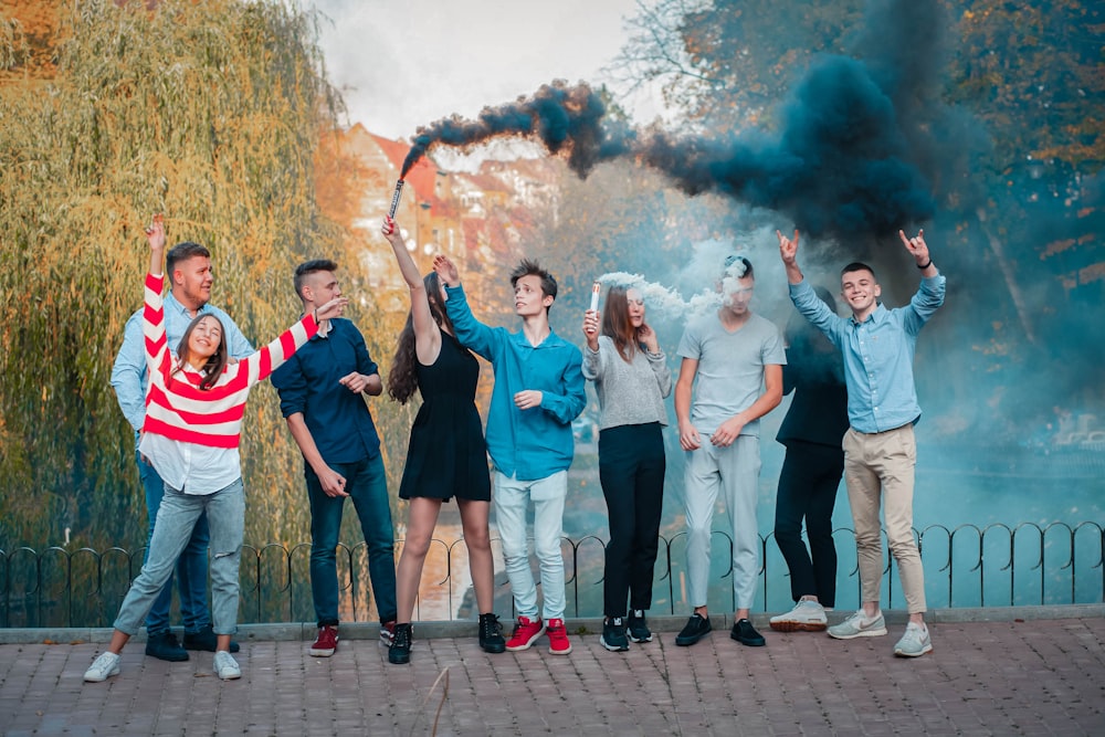 group of people standing on gray concrete floor