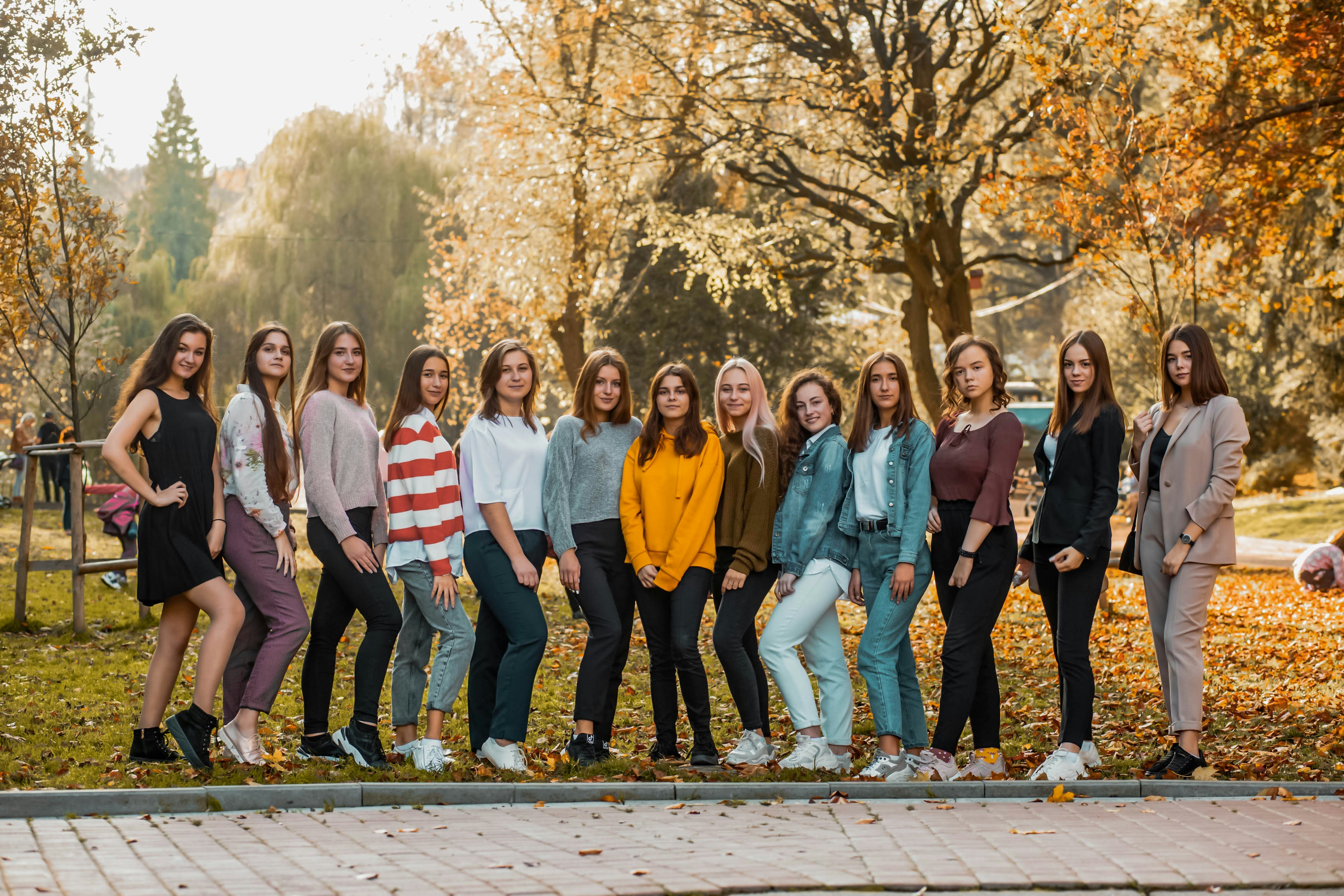 great photo recipe,how to photograph girls; group of people standing on gray concrete pavement