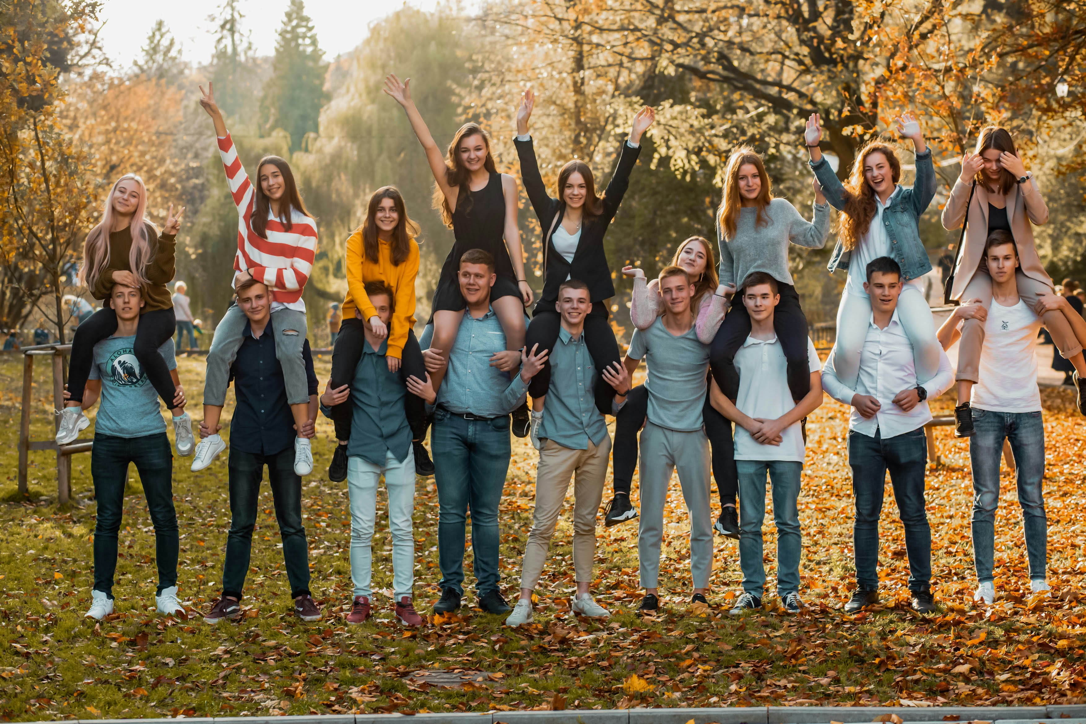 great photo recipe,how to photograph friends; group of people standing on green grass field