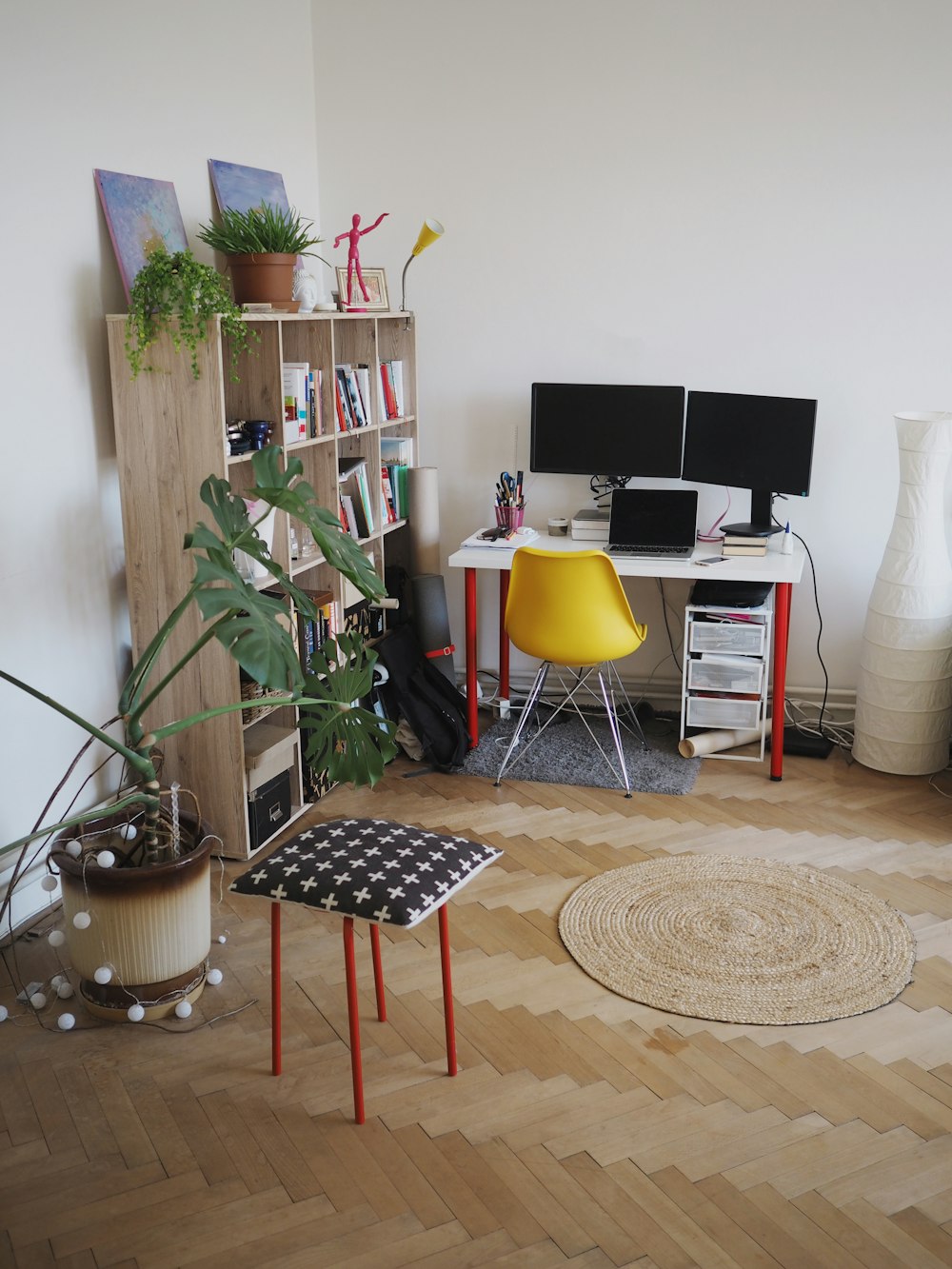 black and yellow chair beside green potted plant