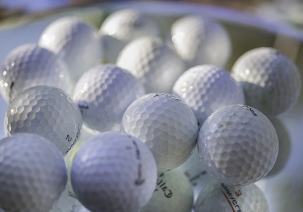 white golf ball on green golf course