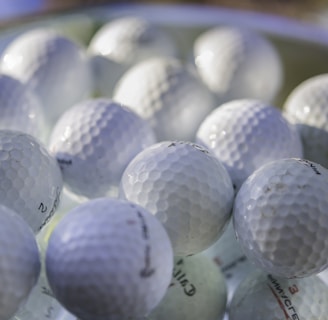 white golf ball on green golf course