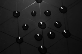 black round plastic on black surface