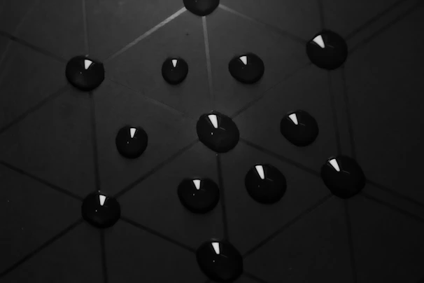 black round plastic on black surface