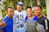 A smiling family standing in front of their new rental home.