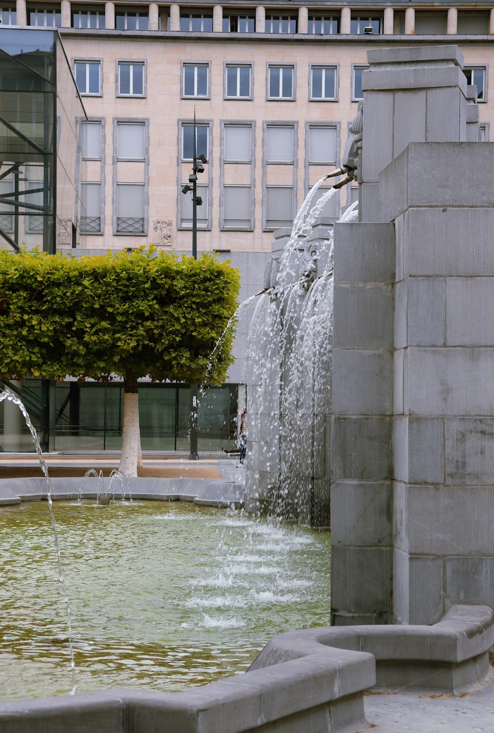 water fountain near green plant