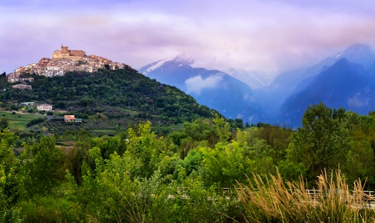 green trees on mountain under white clouds during daytime in Casoli Italy