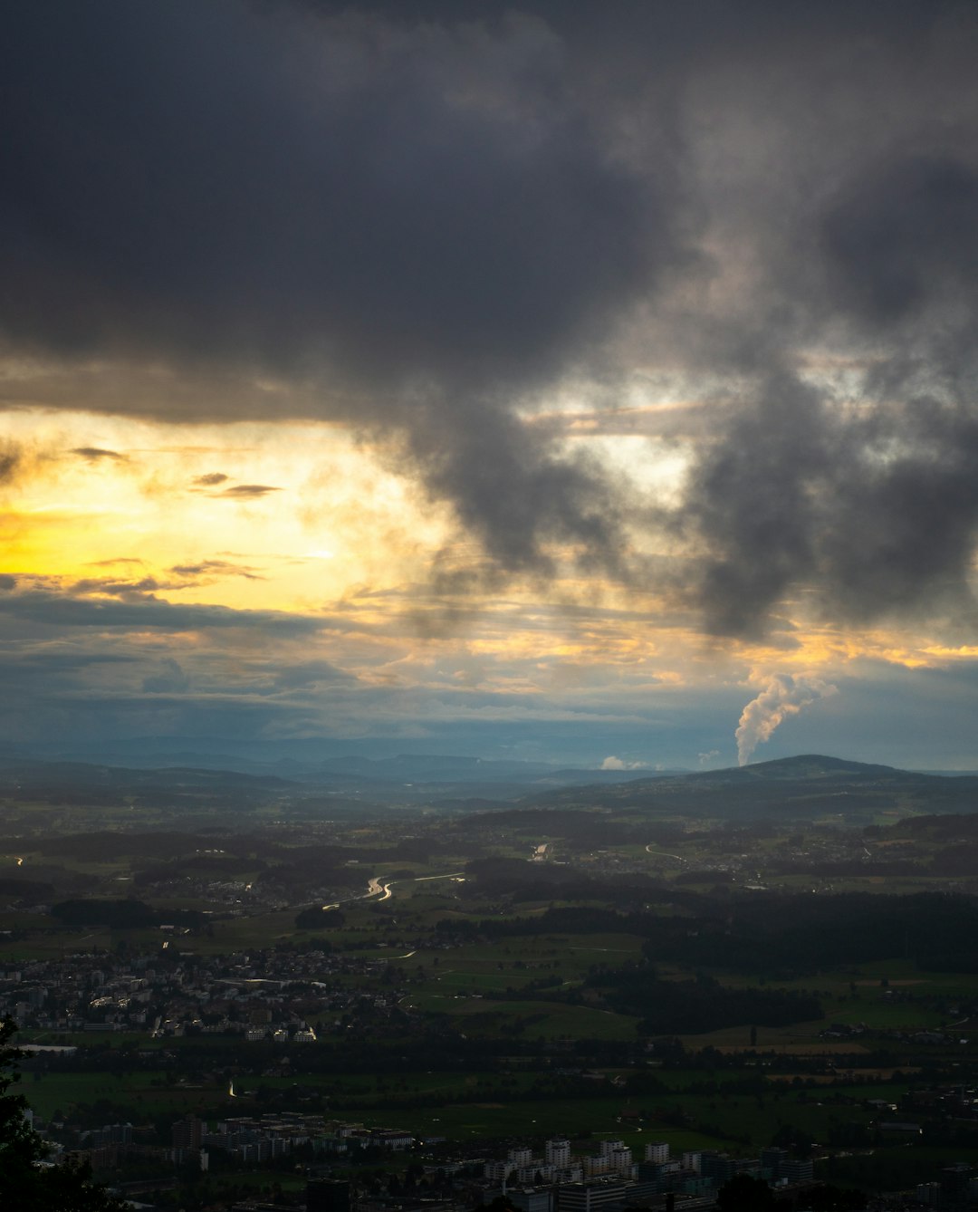 aerial view of city under cloudy sky during daytime