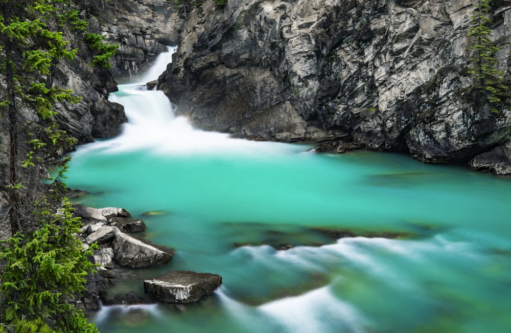 rocky mountain with water falls