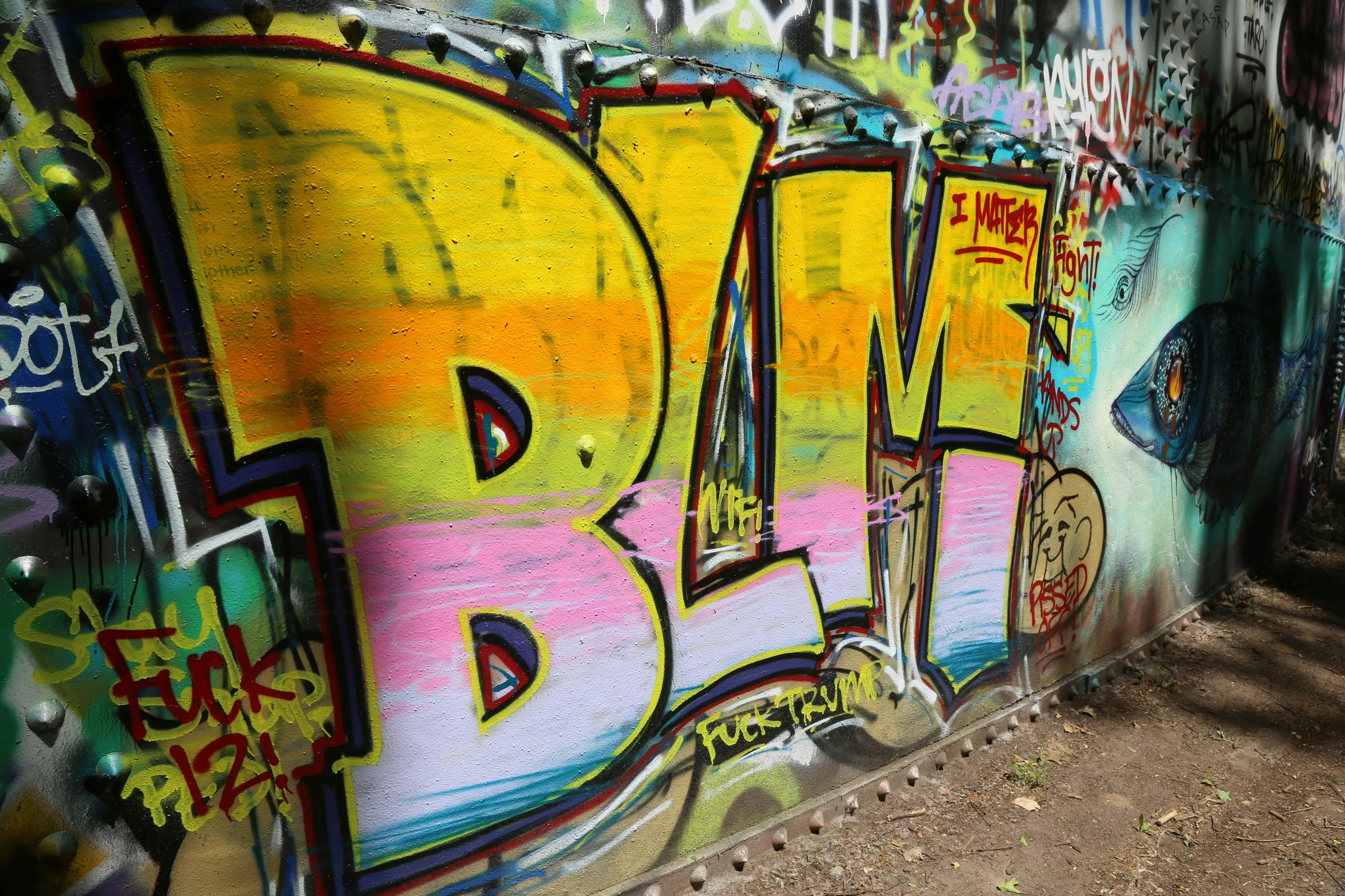 yellow purple and blue graffiti art