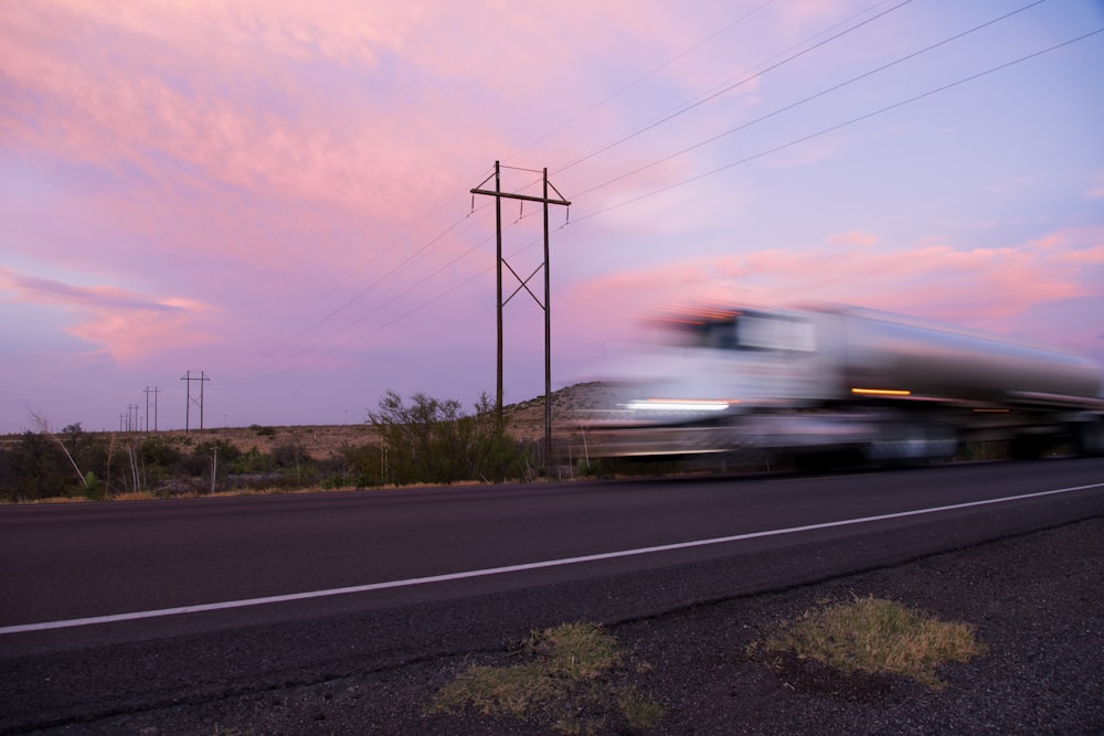 white train on rail road during daytime