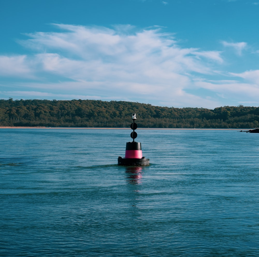 person in red kayak on blue sea under blue sky during daytime