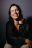 smiling woman in black fur coat