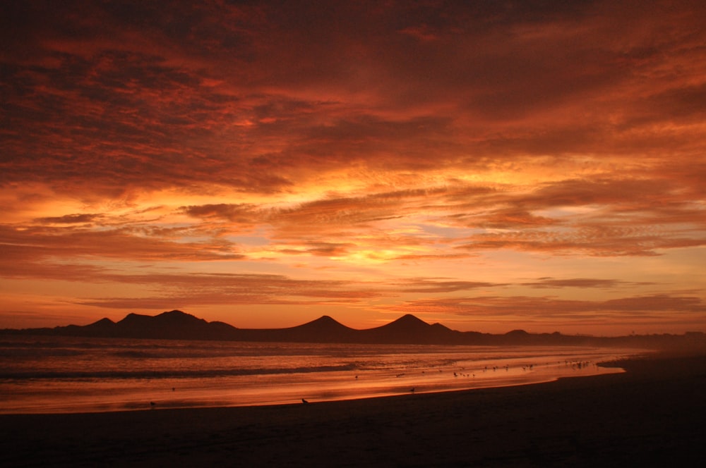 silhouette of mountains during sunset