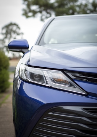 blue car on road during daytime