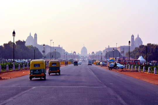 yellow bus on road during daytime in New Delhi India