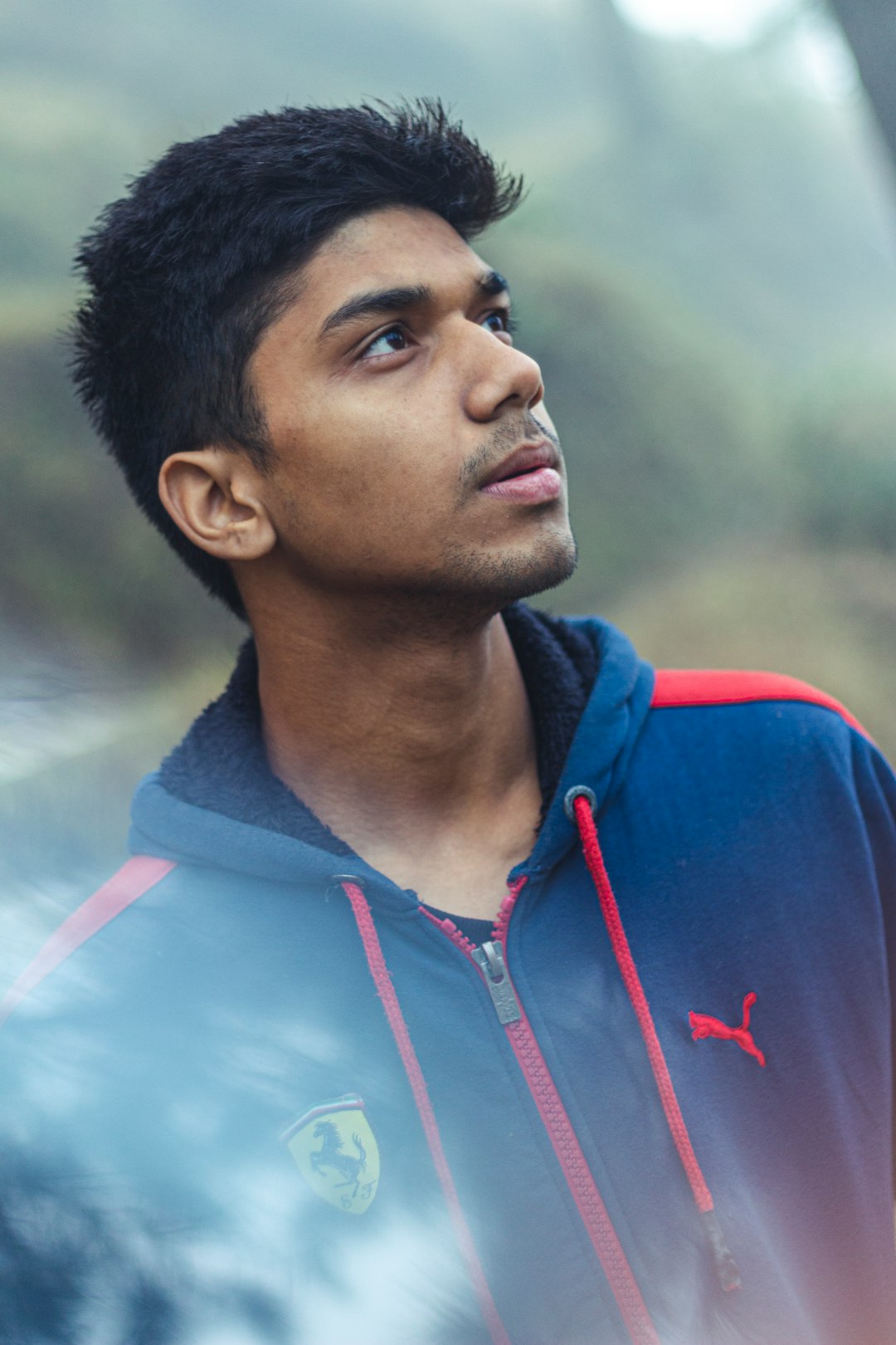 man in blue and red zip up hoodie